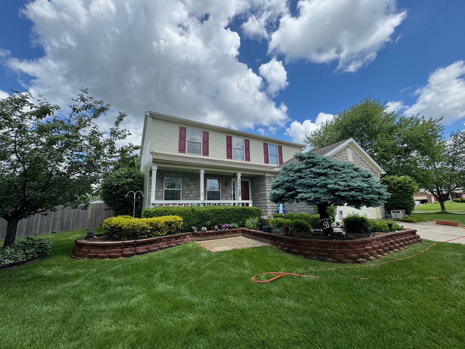 Soft-washed vinyl-and-brick two-story home in a Blacklick, OH subdivision